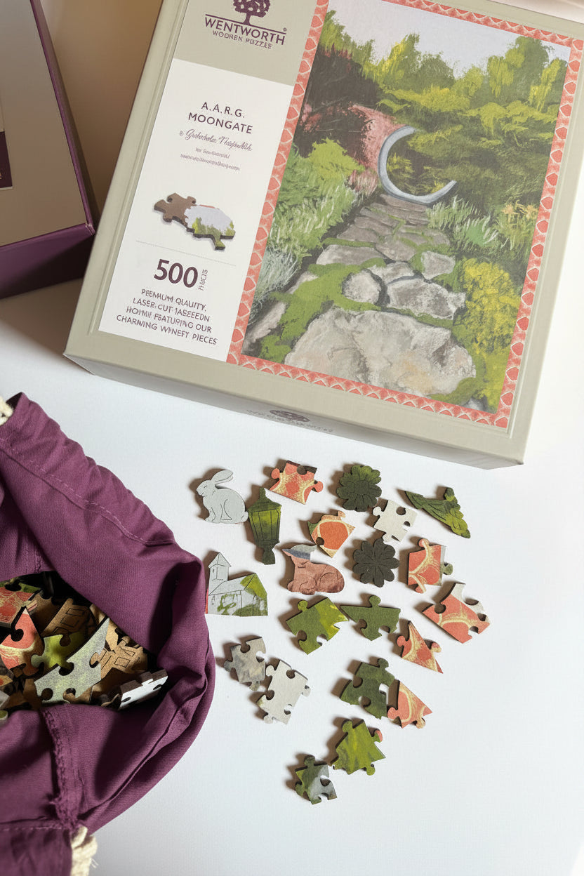 Photo of the Abby Aldrich Rockefeller Garden (A.A.R.G.) Moongate puzzle box and unique whimsy pieces, including charming shapes such as a bunny.