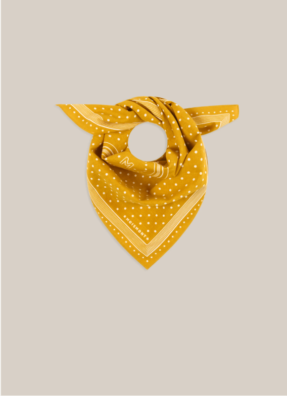 Allegra N'843 Moismont Scarf in Farandole yellow tied as a neckerchief.