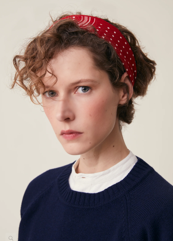 Model wearing Allegra N'843 Moismont Scarf in Theater red as a hair tie.