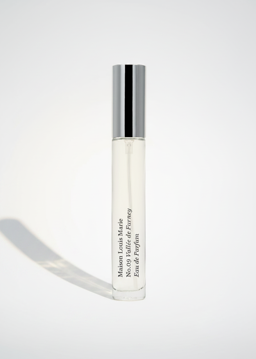 Bottle of No.09 Vallée de Farney, Eau de Parfum Travel Spray on white background.