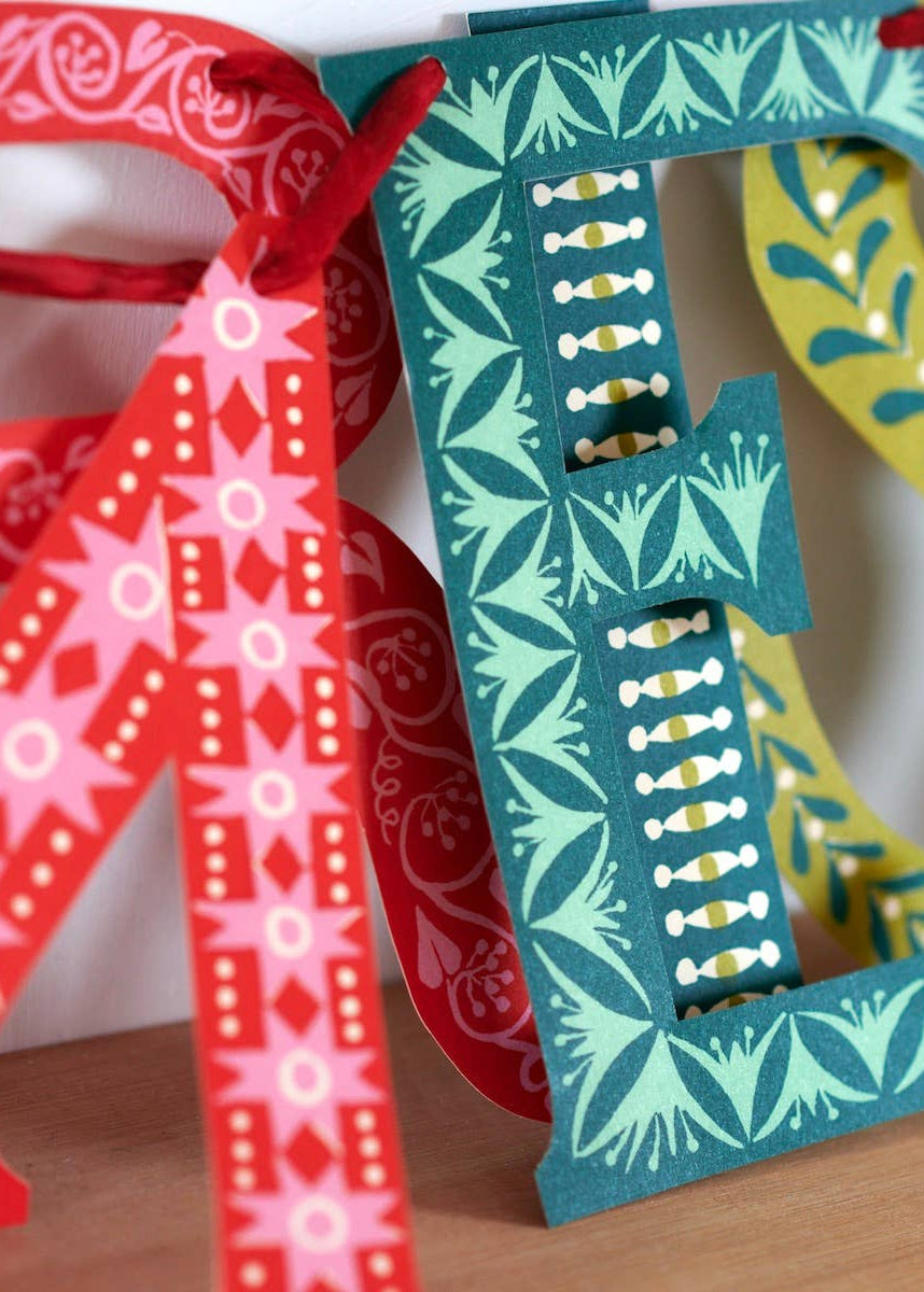 A close up photo of banner letters showing design details.
