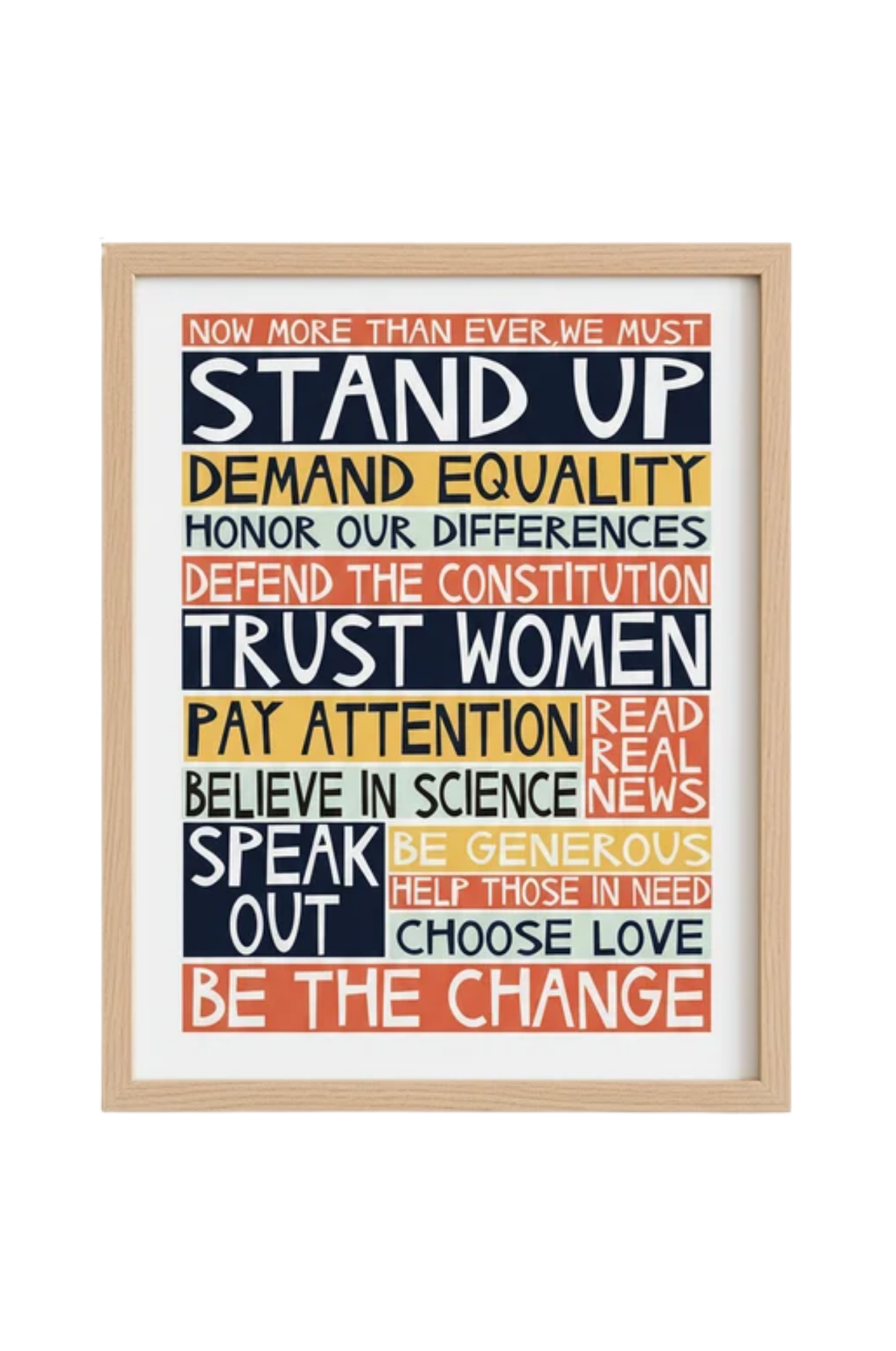 A framed image of the "Stand Up" archival print by Jennifer Judd-McGee, which reads "Now more than ever, we must stand up, demand equality, honor our differences, defend the constitution, trust women, pay attention, read real news, believe in science, speak out, be generous, help those in need, choose love, be the change."