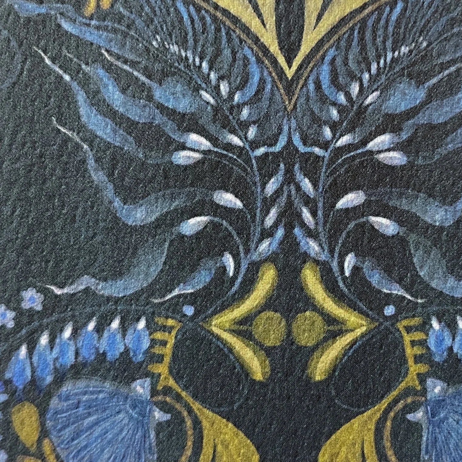 Close-up of a patterned background with blue, yellow, and black colors.