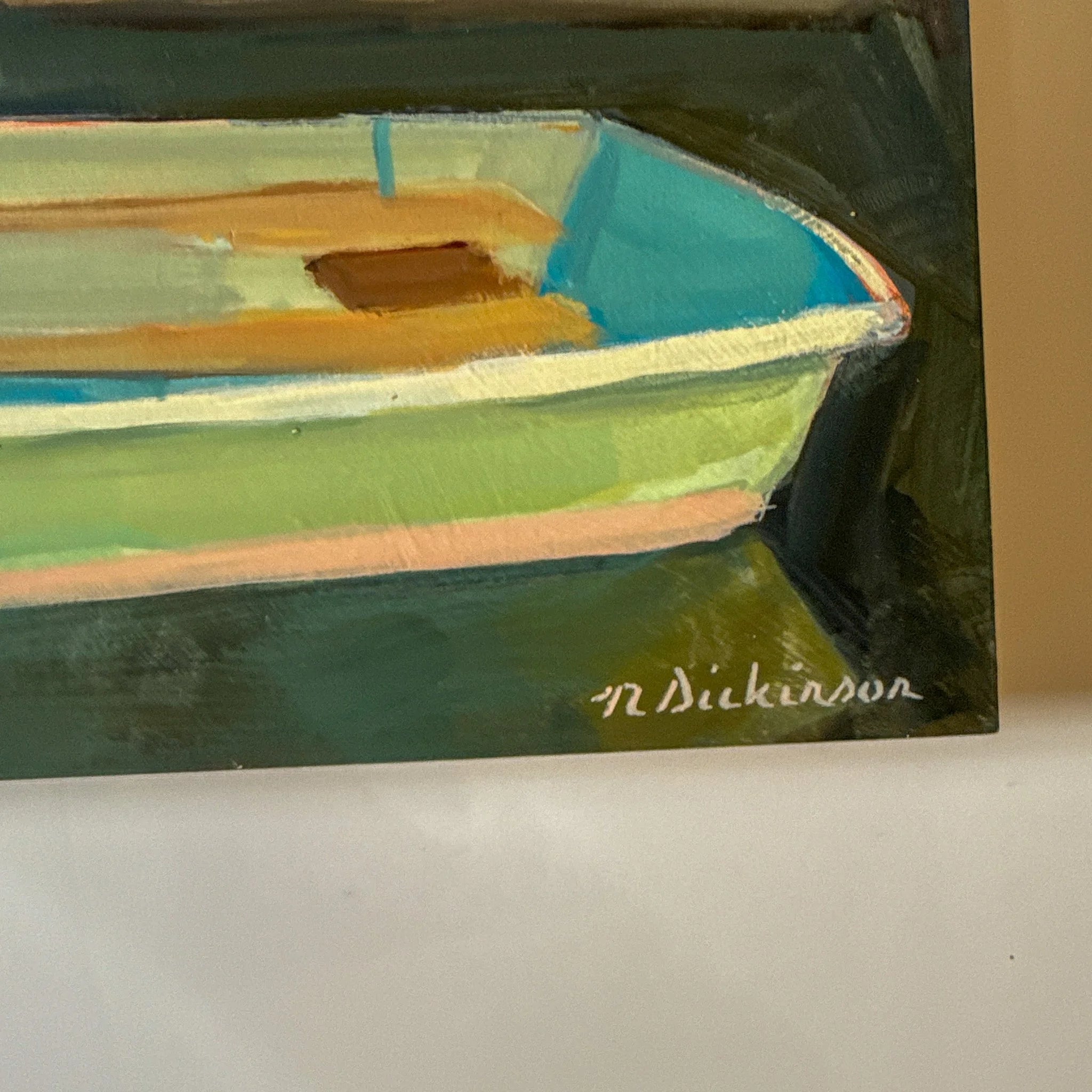 Painting of a boat with a signature on a white surface