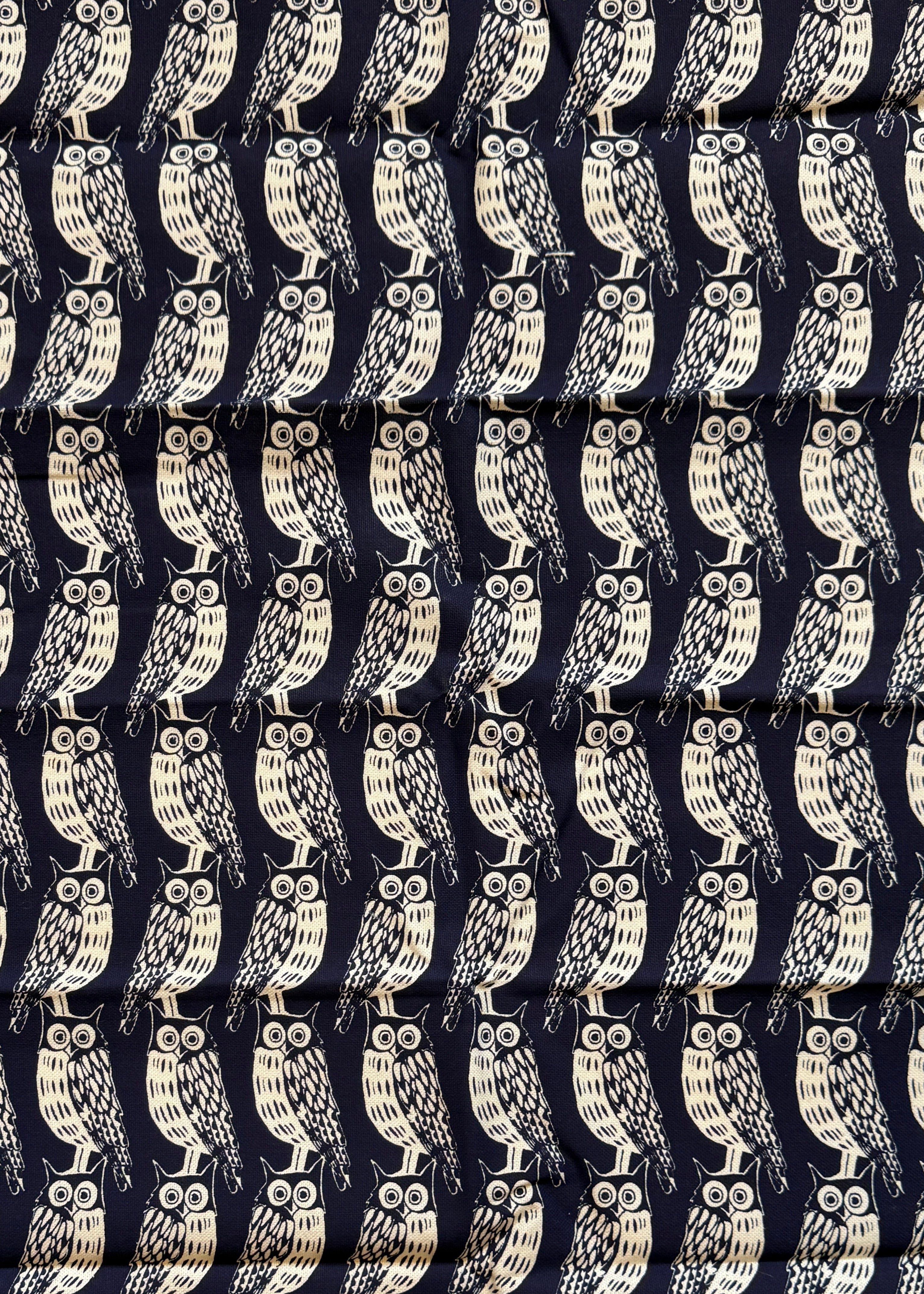 Navy blue fabric with white pattern and 'Cambridge Impprint' text on a white background