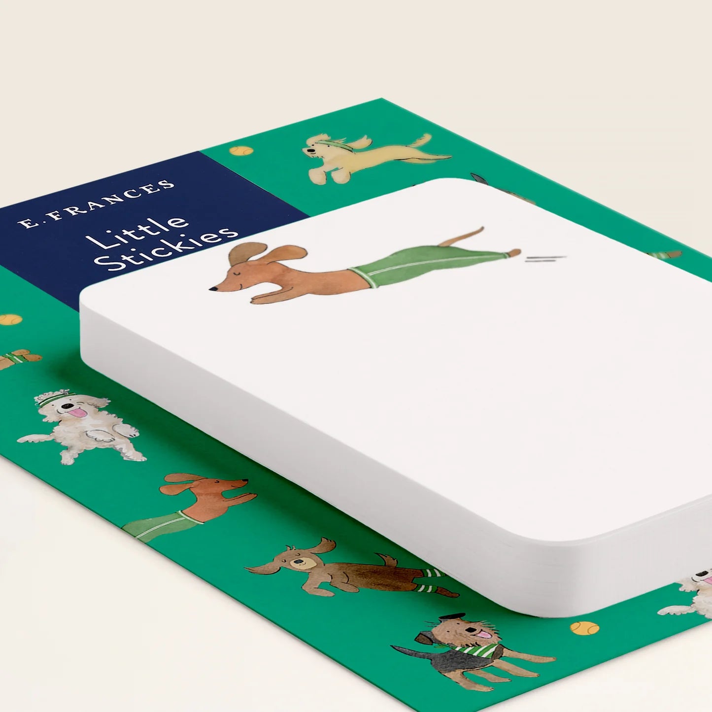 Sticky notes call 'Little Stickies' with illustrations of dogs on a green background
