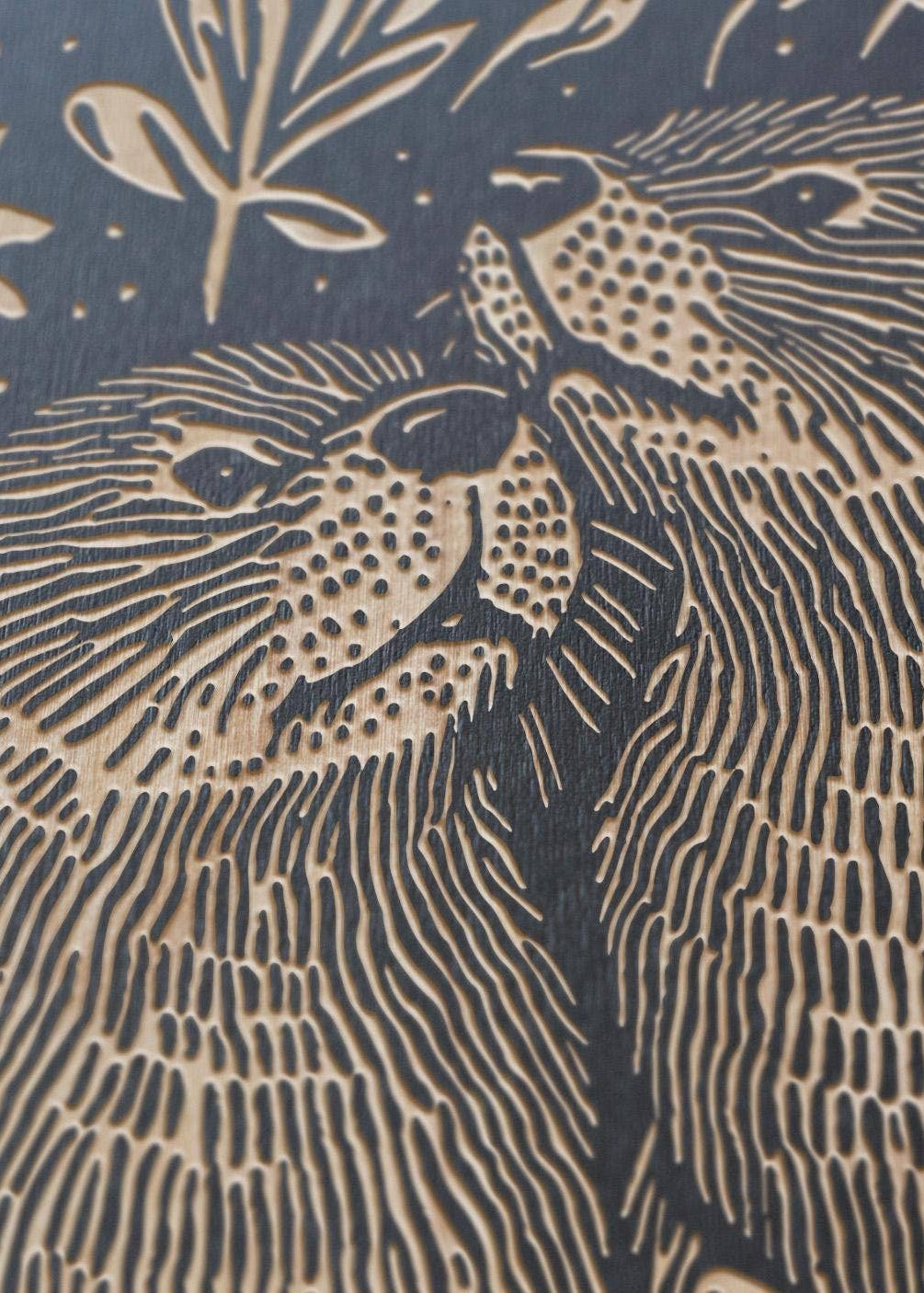 A close up of the Otters Engraved Birch Wood Panel, showing engraving details.