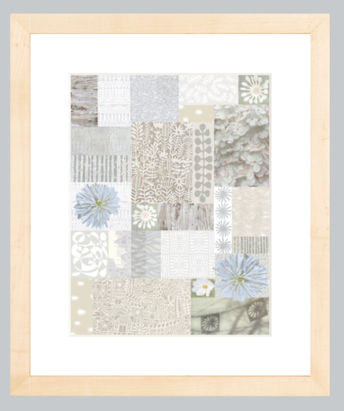 Framed artwork with a patchwork design featuring flowers on a gray background