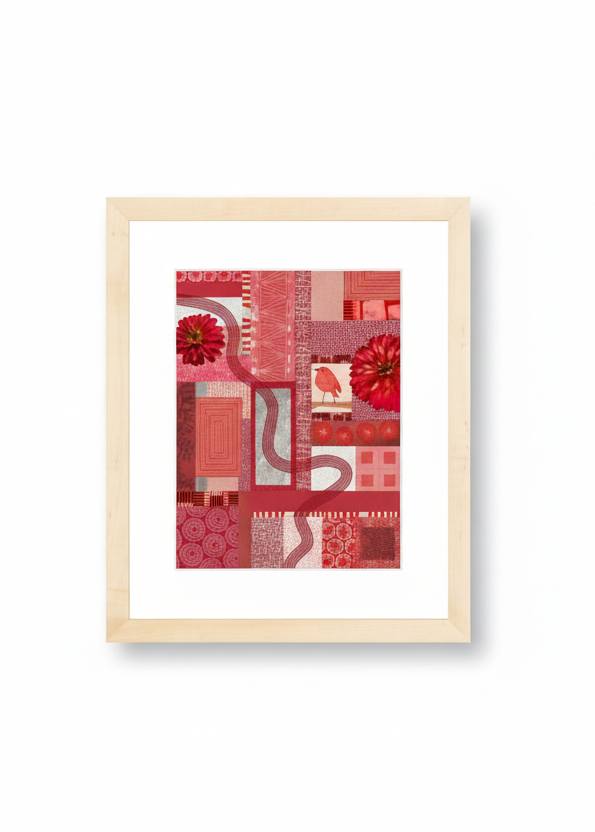 Framed abstract art print with red and pink patterns on a white wall