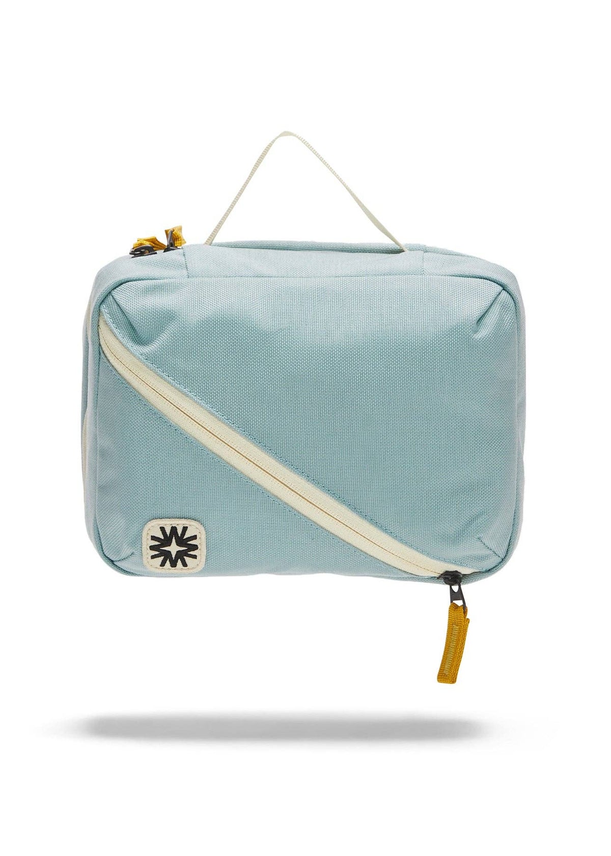 Front view of toiletry bag showing top handle, and front diagonal pocket.