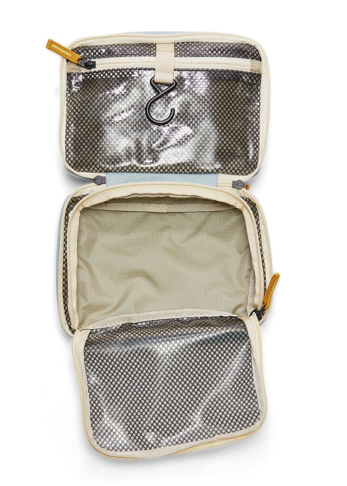 Interior photo of the toiletry bag featuring open clear mesh zipper pockets and a hook for hanging.