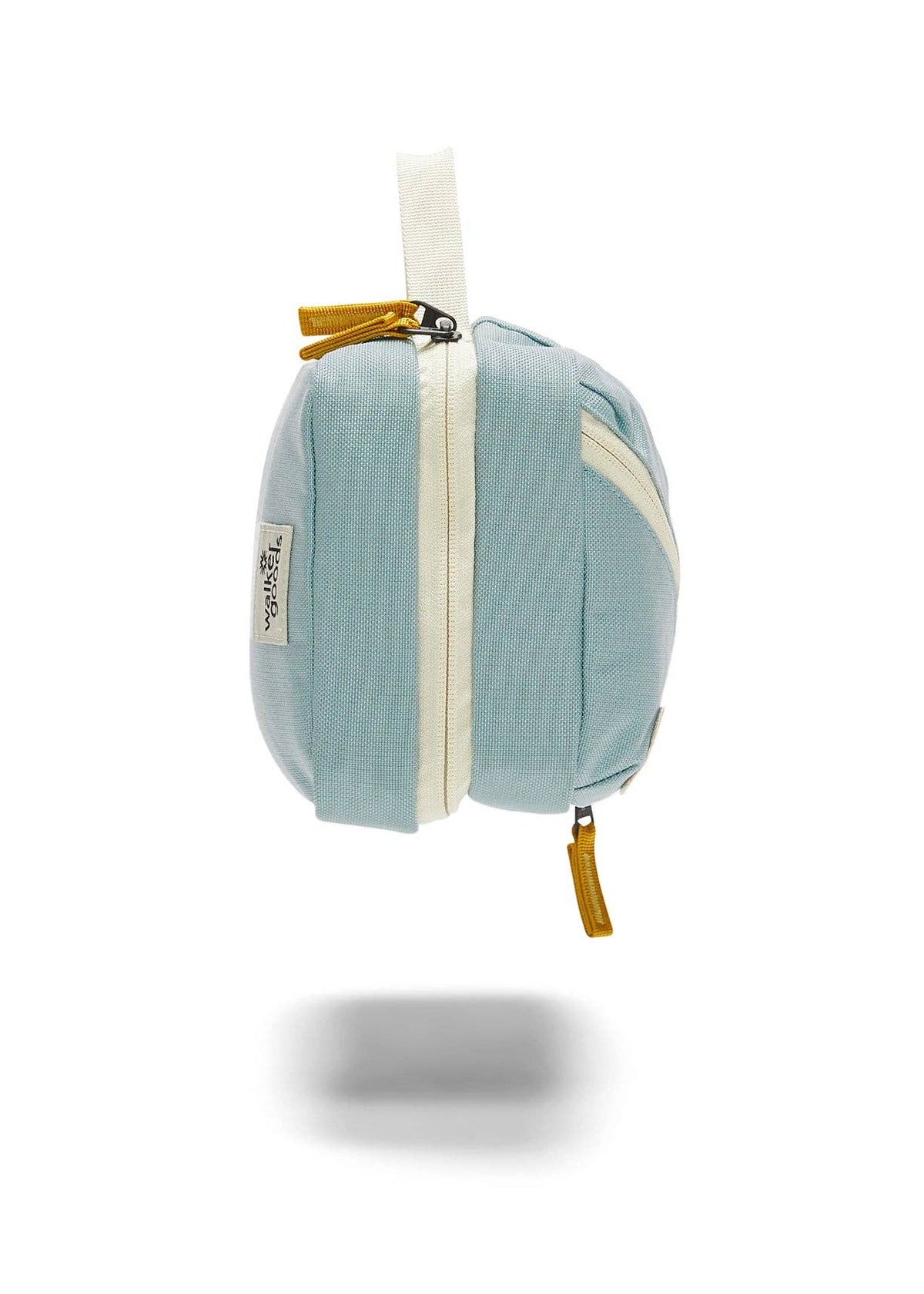Side view of toiletry bag showing zipper details.