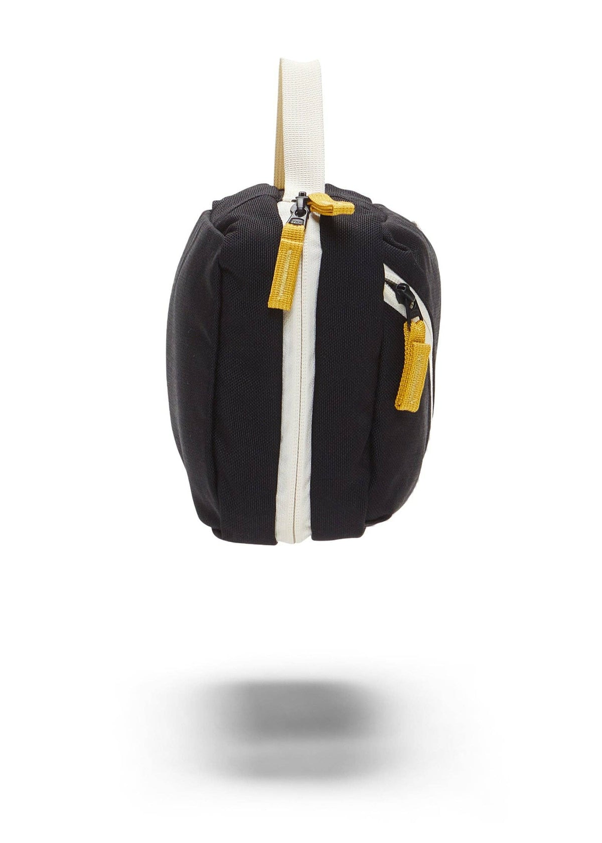 Side view of Toiletry Bag showing yellow zipper details.