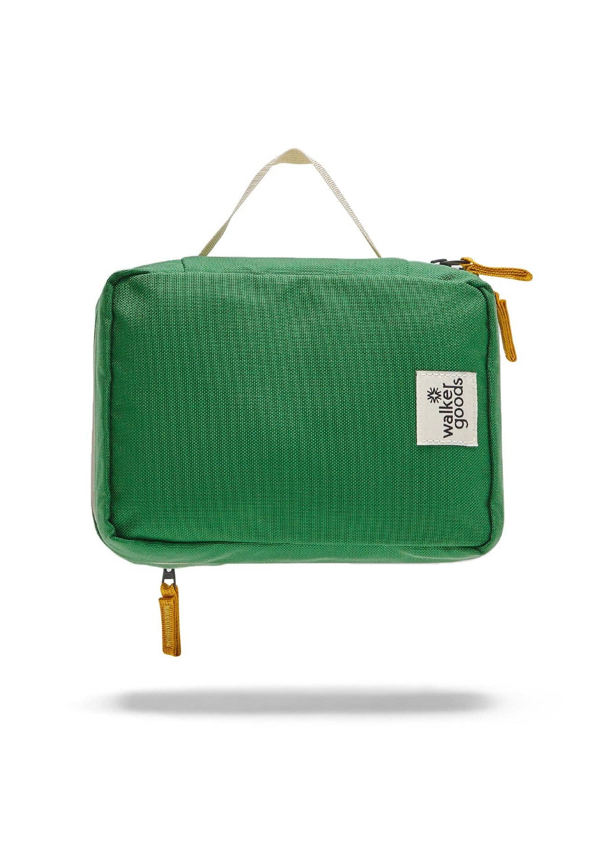 Rear view of the toiletry bag with top handle and company label.