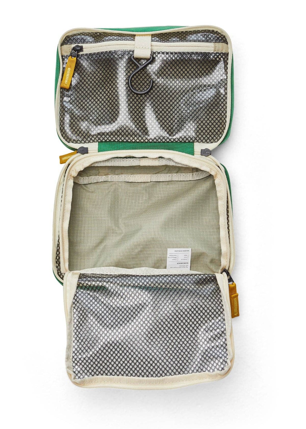 Interior photo of the toiletry bag featuring open clear mesh zipper pockets and a hook for hanging.