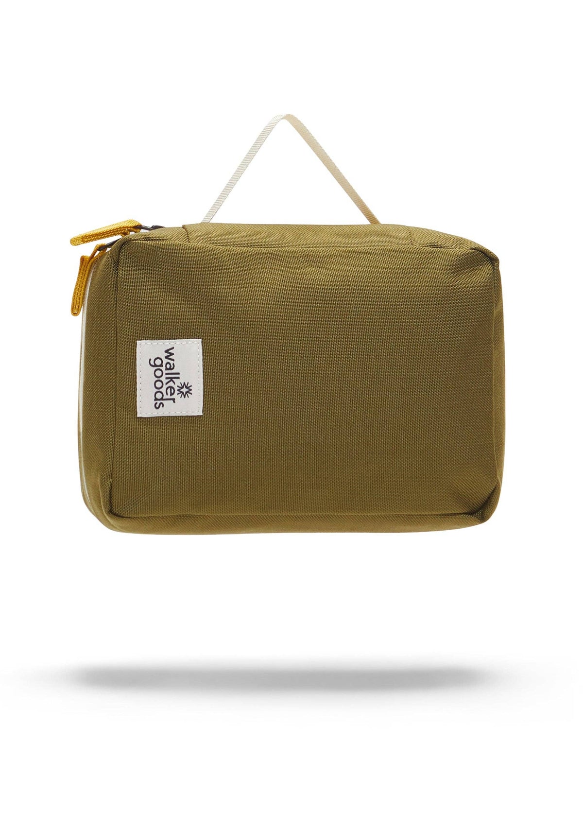 Rear view of the toiletry bag with top handle and company label.