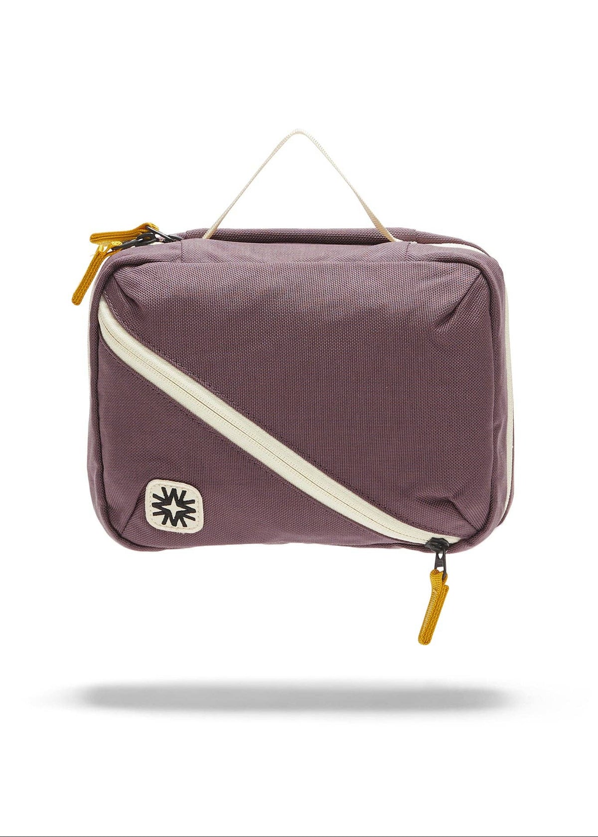 Front view of toiletry bag showing top handle, and front diagonal pocket.