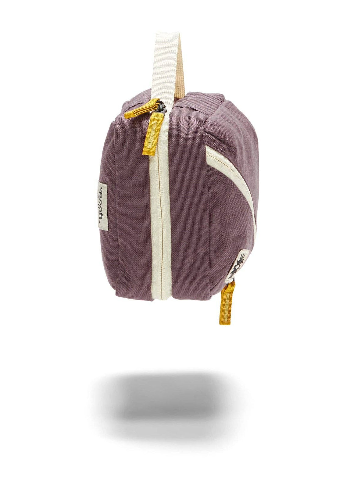 Side view of Toiletry Bag showing yellow zipper details.