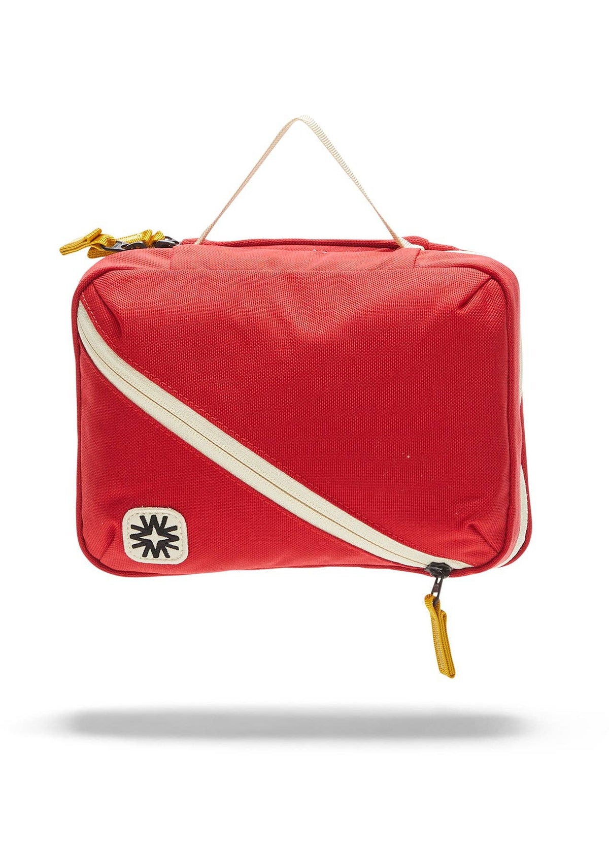 Front view of toiletry bag showing top handle, and front diagonal pocket.