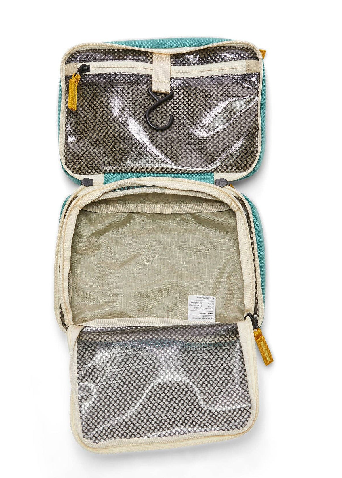 Interior photo of the Toiletry Bag featuring open clear mesh zipper pockets and a hook for hanging.