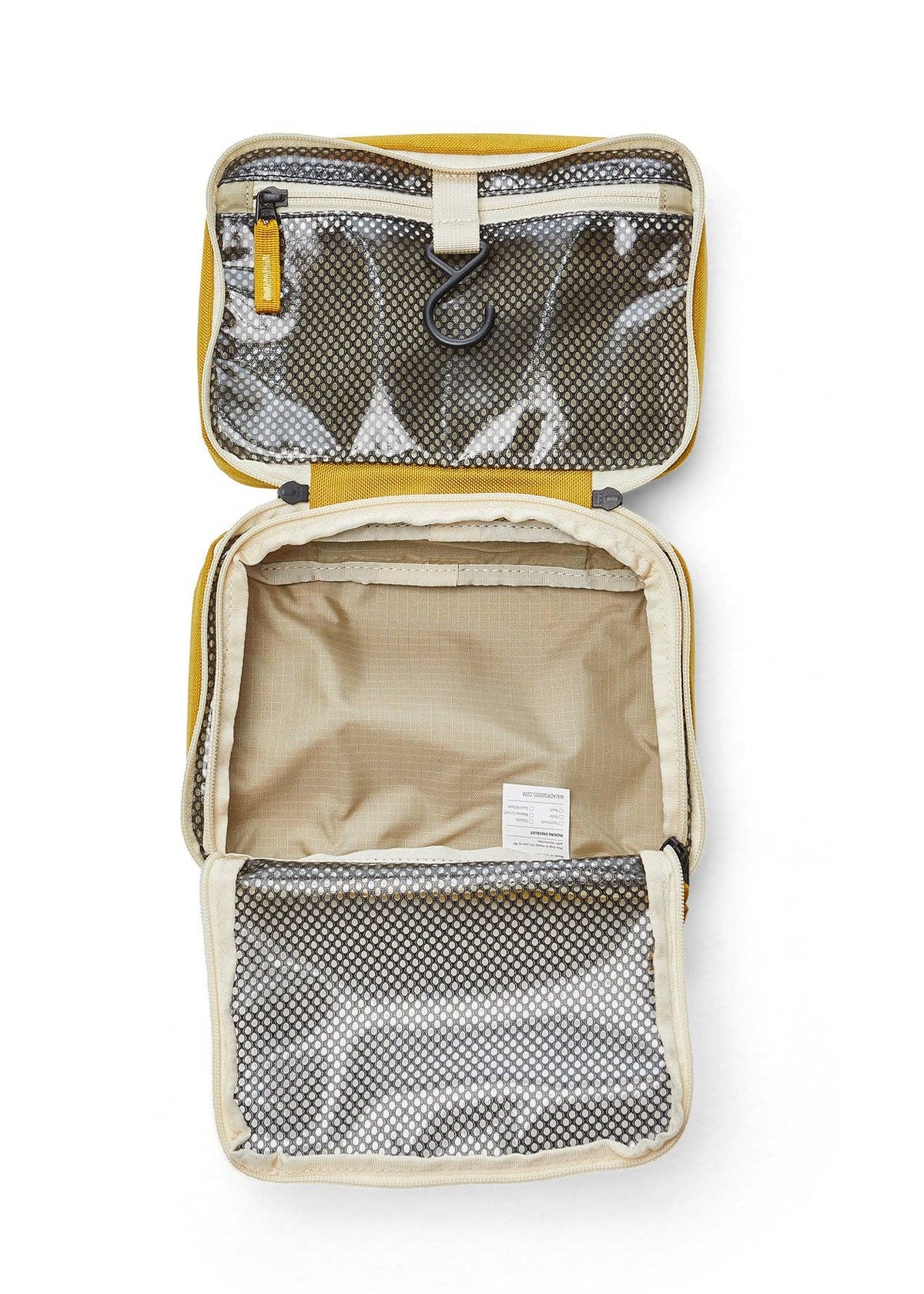 Interior photo of the Toiletry Bag featuring open clear mesh zipper pockets and a hook for hanging.