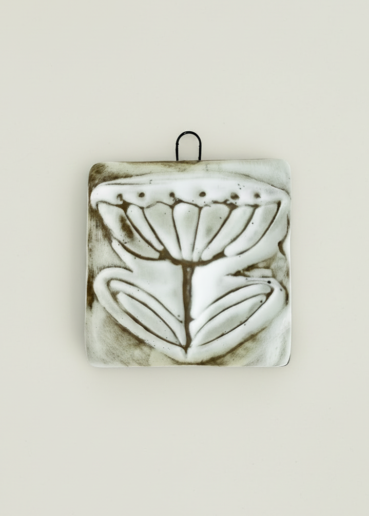 Wall tile with Buttercup design in white finish.