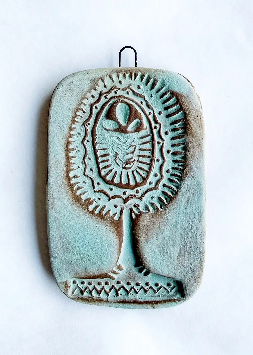 Wall tile with folk tree in turquoise finish.