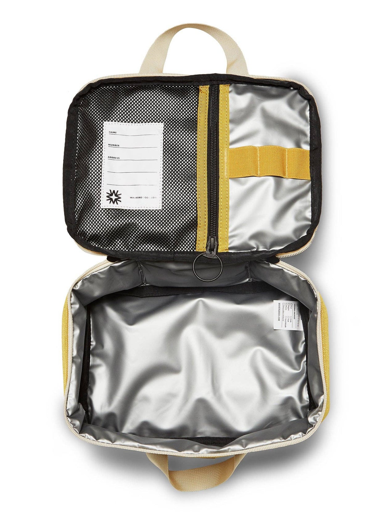 Inside of the Yellow Lunchbox by Walker Family Goods, showing insulation, inner mesh pocket and utensil holder straps.